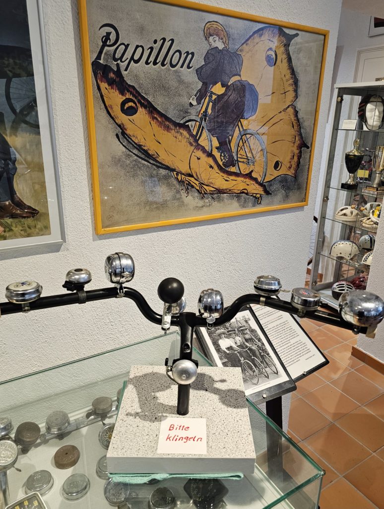 Rheinhessen Bicycle Museum - Bell collection on a bicycle handlebar