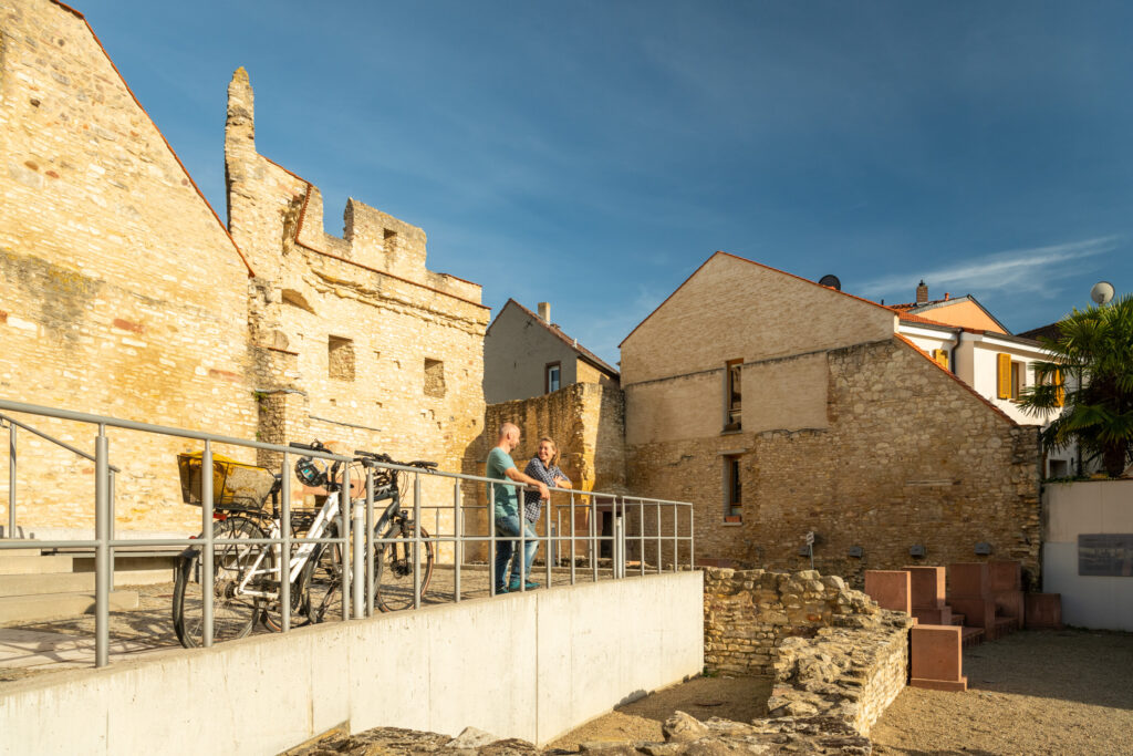 Cyclists visit the Heidenheim Gate, part of the former imperial palace in Ingelheim